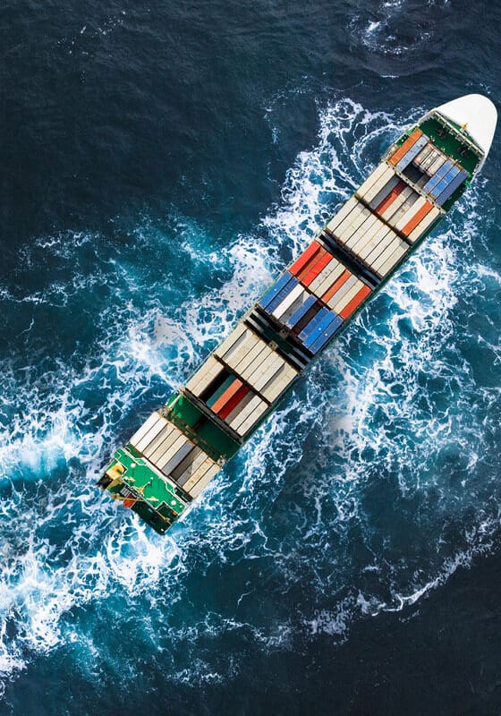 Container ship in export and import. International shipping cargo. Aerial view