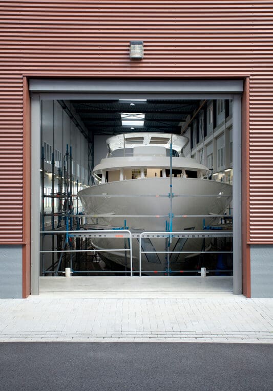 Indoor shipyard building a yacht